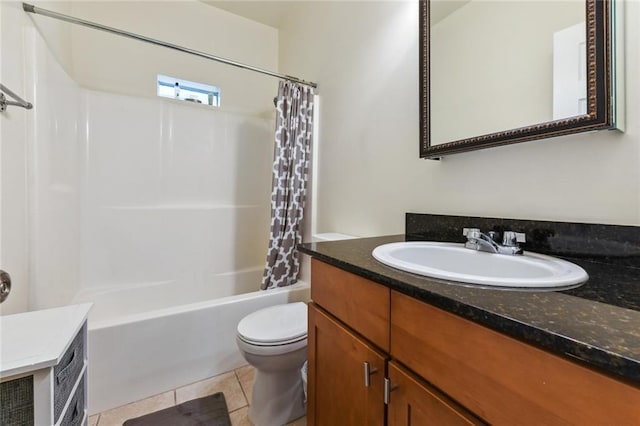 full bathroom featuring shower / tub combo with curtain, vanity, tile patterned floors, and toilet