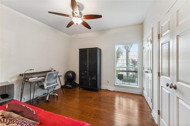 office space featuring dark hardwood / wood-style floors and ceiling fan