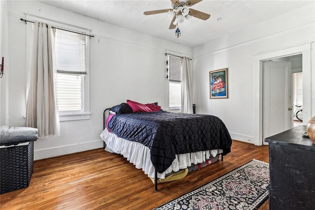 bedroom with wood-type flooring and ceiling fan