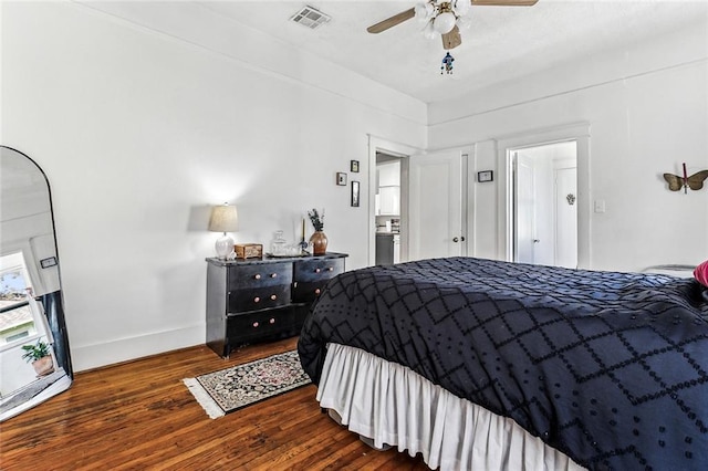 bedroom featuring dark hardwood / wood-style flooring and ceiling fan