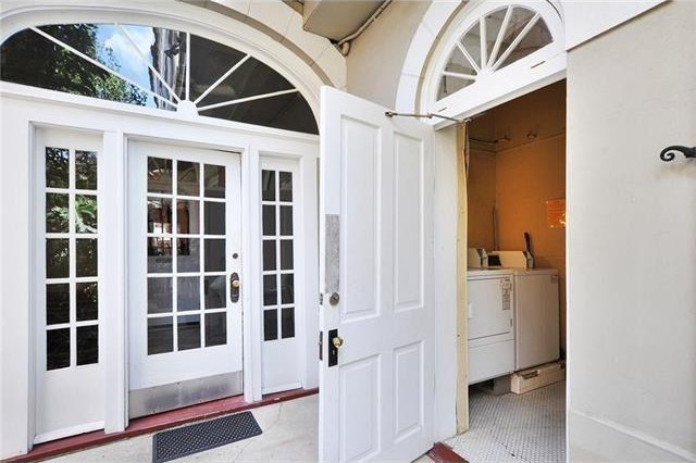 exterior space with washer and dryer and french doors