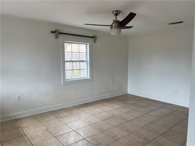 empty room featuring crown molding and ceiling fan