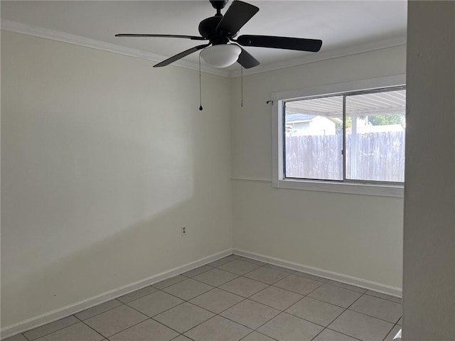 spare room featuring ornamental molding and light tile patterned floors