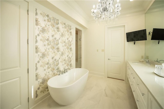 bathroom with vanity, a washtub, crown molding, and an inviting chandelier