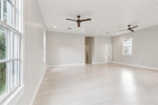 spare room with ceiling fan and light hardwood / wood-style flooring