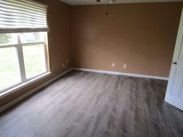 unfurnished room with hardwood / wood-style floors