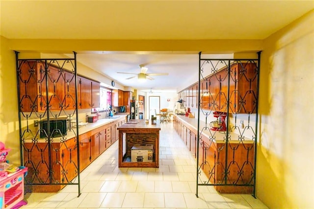 kitchen featuring ceiling fan and stainless steel fridge