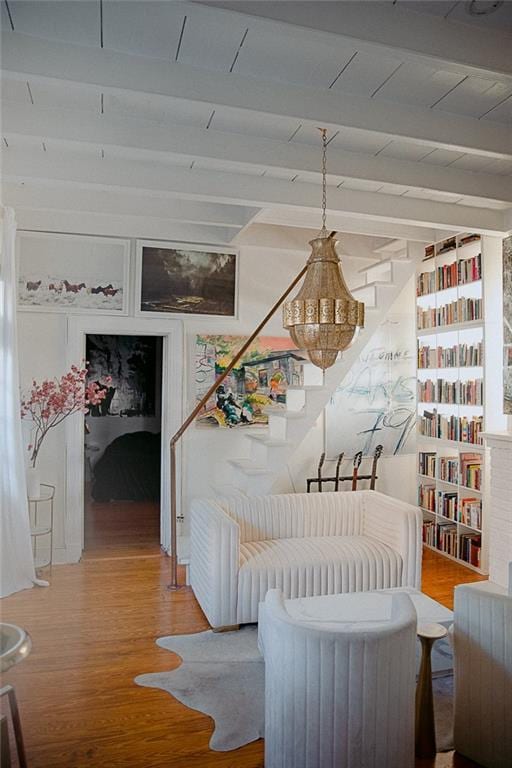 interior space with hardwood / wood-style flooring and beamed ceiling