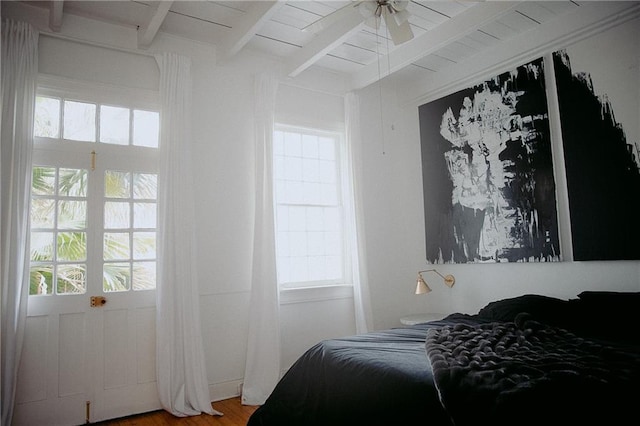 bedroom featuring wood ceiling, beam ceiling, and wood-type flooring