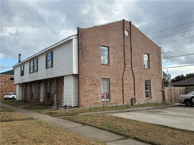 view of side of property featuring a yard