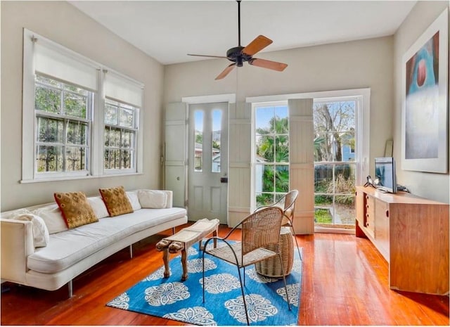 sunroom / solarium featuring ceiling fan