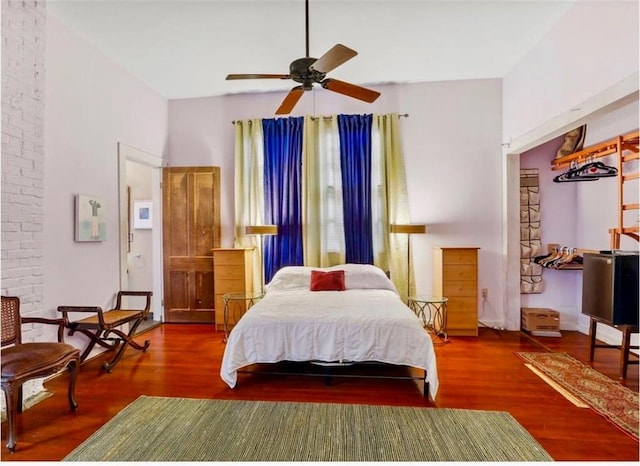 bedroom with wood finished floors and a ceiling fan