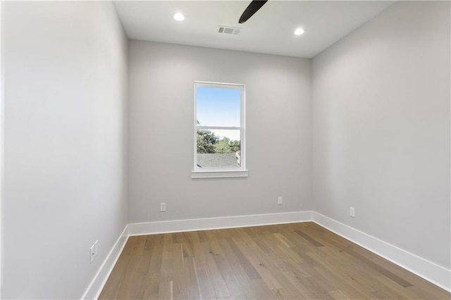 unfurnished room with ceiling fan and light wood-type flooring