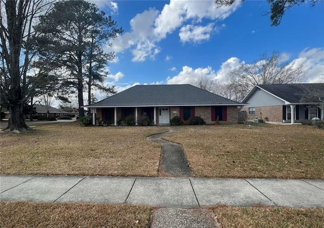 ranch-style house with a front lawn