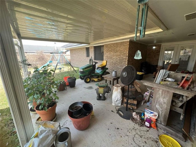 view of patio featuring a playground and french doors