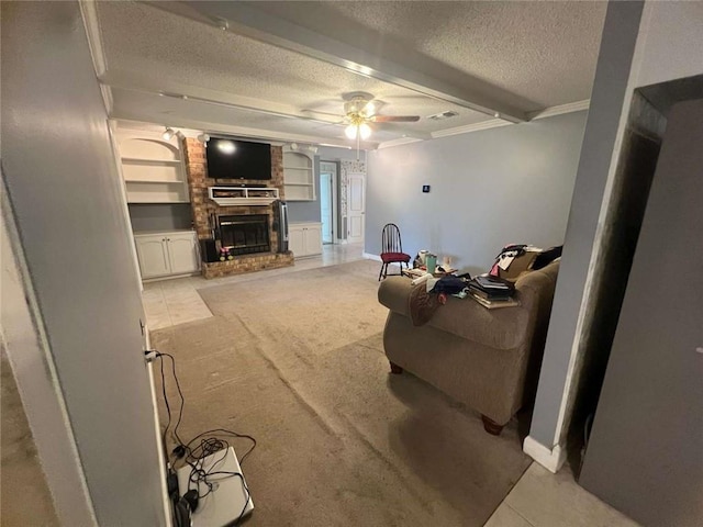 carpeted living room with beamed ceiling, ceiling fan, crown molding, a brick fireplace, and a textured ceiling