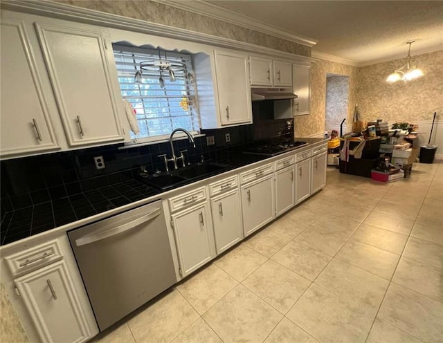 kitchen featuring tile countertops, dishwasher, sink, hanging light fixtures, and ornamental molding