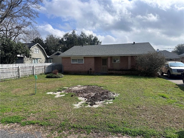 ranch-style house featuring a front lawn