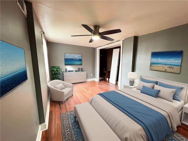 bedroom with hardwood / wood-style flooring and ceiling fan