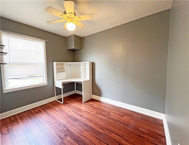 unfurnished bedroom featuring hardwood / wood-style flooring and ceiling fan