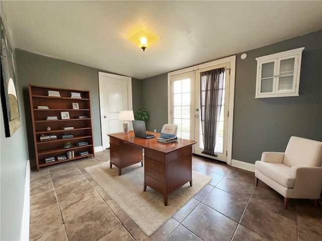 office with tile patterned flooring and french doors