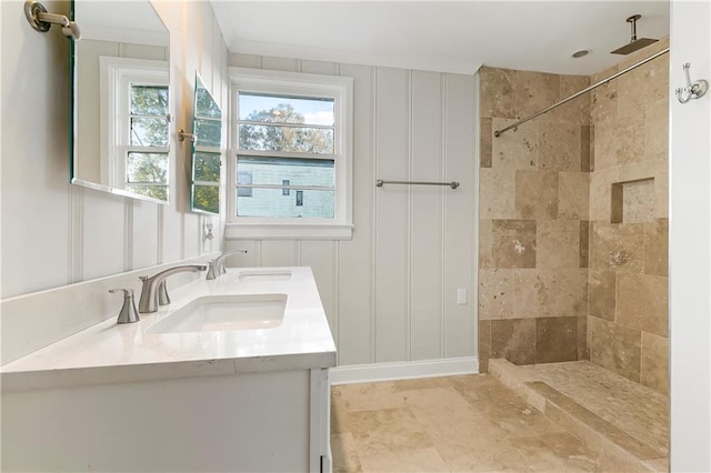 bathroom featuring vanity and a tile shower