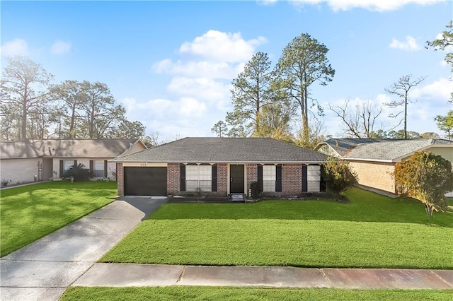 single story home featuring a garage and a front lawn