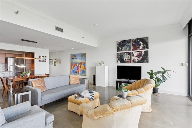 living room featuring crown molding and concrete floors