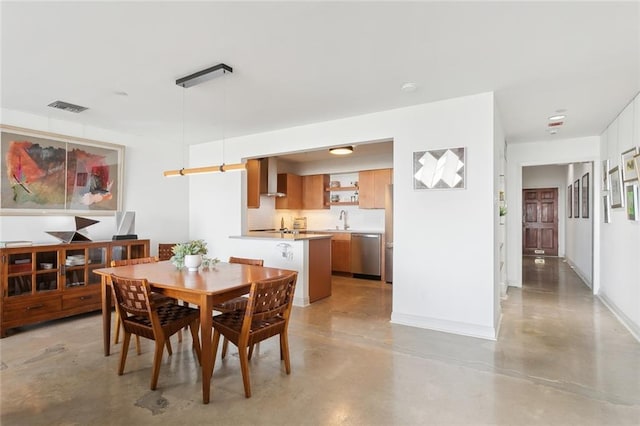 dining room featuring sink