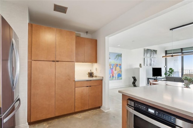 kitchen with tasteful backsplash, wine cooler, and stainless steel refrigerator