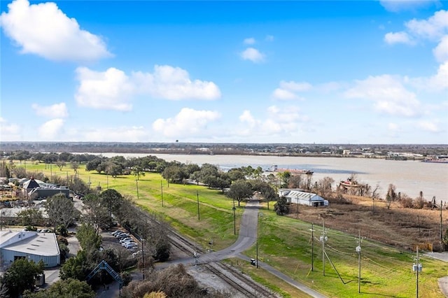 birds eye view of property with a water view