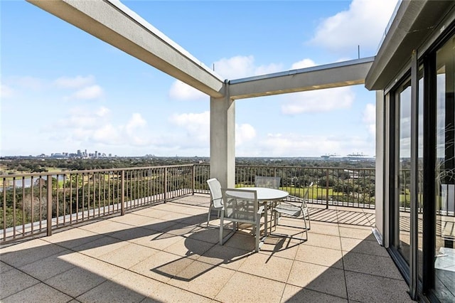 view of patio featuring a balcony