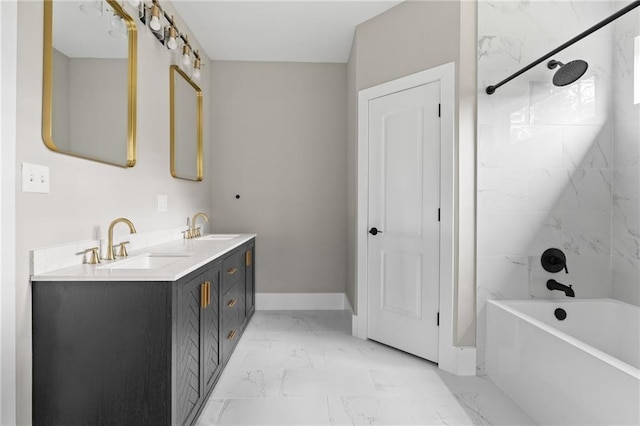 bathroom featuring tiled shower / bath combo and vanity