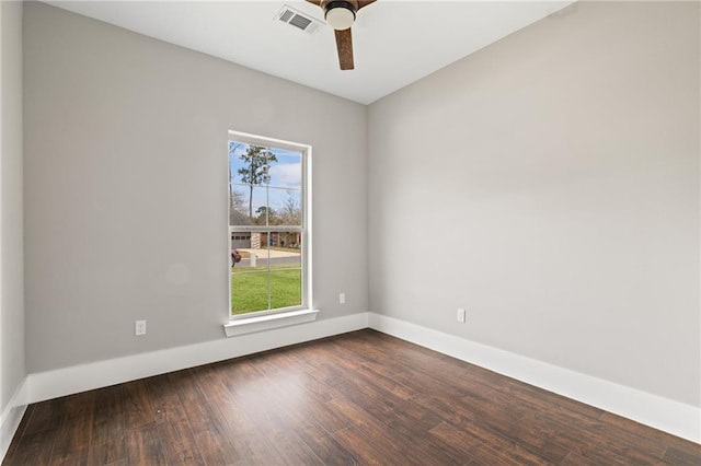 spare room with dark hardwood / wood-style floors and ceiling fan