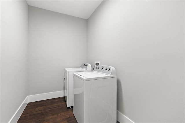 laundry room with dark hardwood / wood-style floors and washer and dryer