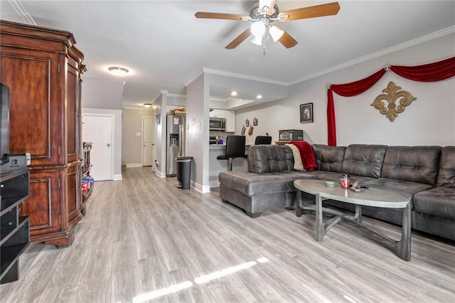 living room with crown molding, ceiling fan, and light wood-type flooring