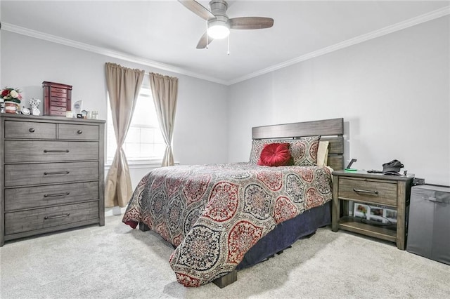 bedroom with crown molding, light colored carpet, and ceiling fan