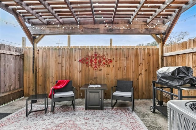 view of patio / terrace with a grill and a pergola