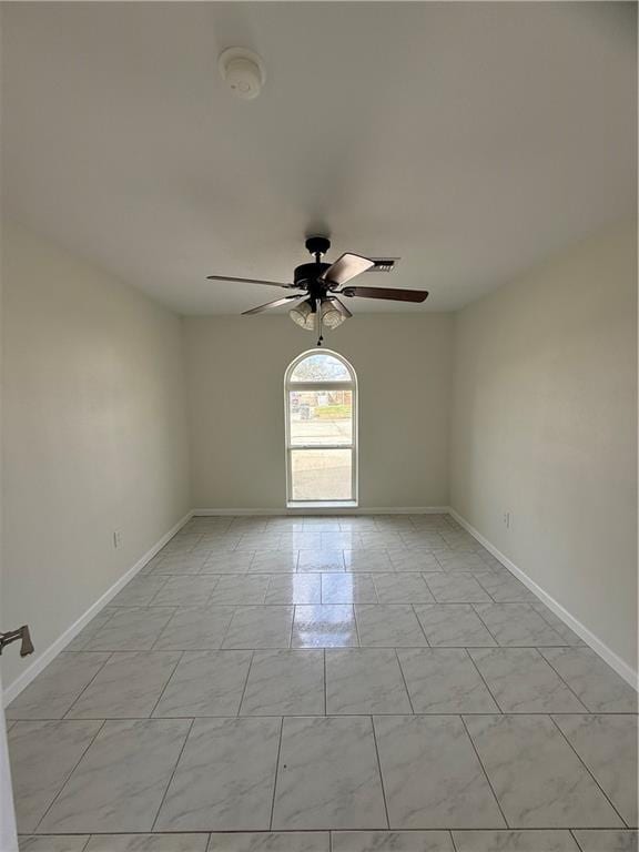 spare room featuring ceiling fan