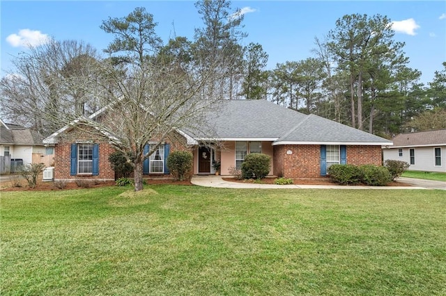 single story home featuring a front yard