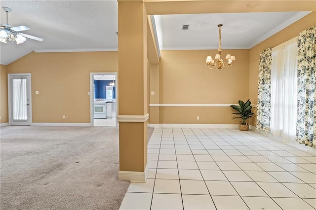 carpeted empty room featuring crown molding, vaulted ceiling, ceiling fan with notable chandelier, and a wealth of natural light