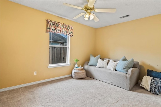 interior space with carpet and ceiling fan