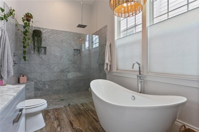 bathroom with separate shower and tub, hardwood / wood-style floors, and toilet