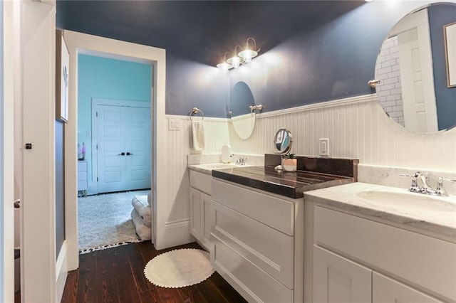 bathroom with vanity and wood-type flooring