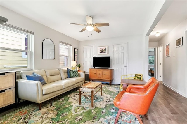 living room featuring plenty of natural light, hardwood / wood-style floors, and ceiling fan