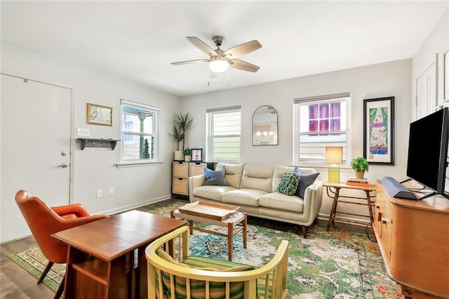 living room with ceiling fan and dark hardwood / wood-style flooring