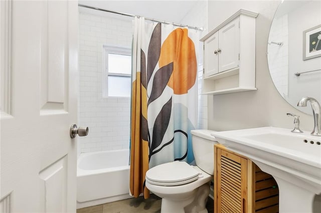 full bathroom featuring sink, shower / bathtub combination with curtain, tile patterned floors, and toilet