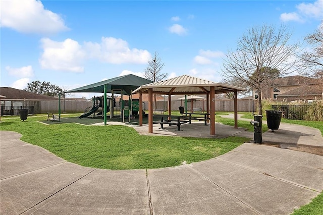 view of community featuring a playground and a lawn