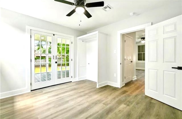 532 Gardere Ave, Harvey, LA 70058 - unfurnished bedroom with wood finished floors, french doors, baseboards, access to exterior, and visible vents