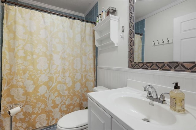 bathroom with ornamental molding, walk in shower, vanity, and toilet